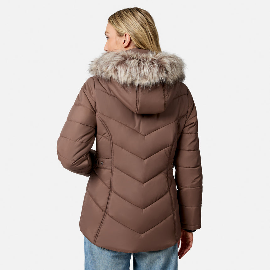 [Model is wearing size S.] A woman shown from the back wearing a brown chevron-quilted puffer jacket with a faux-fur trimmed hood, paired with blue jeans, against a light gray studio background.