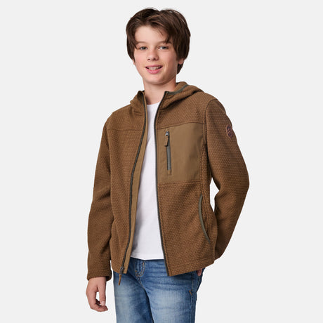 [River is wearing size M.] Young person wearing a brown jacket on a white background