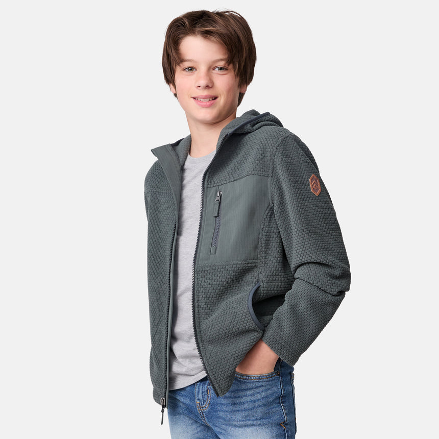[River is wearing size M.] Child wearing a gray/green textured jacket on a white background