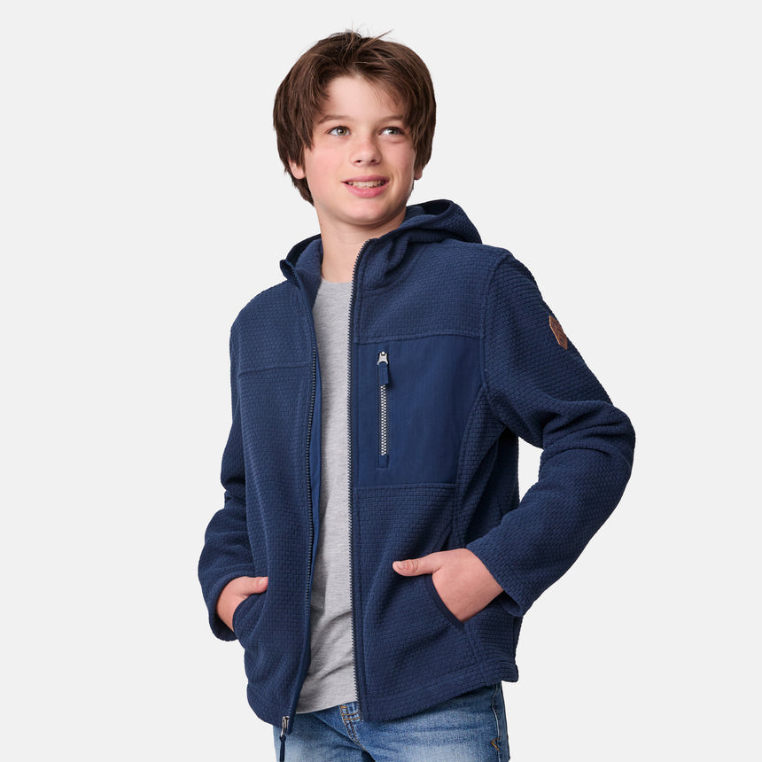 [River is wearing size M.] Child wearing a blue jacket on a white background