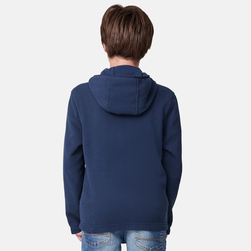 [River is wearing size M.] Person wearing a blue textured hoodie on a light gray background