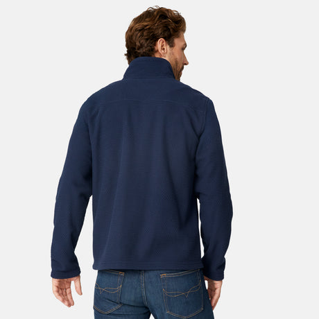 [Matt is 6'2" wearing size M.] Man wearing Free Country Men's Calabaza II Brick Fleece Jacket in navy with a zipper chest pocket, convertible collar, smiling looking forward, light grey background.