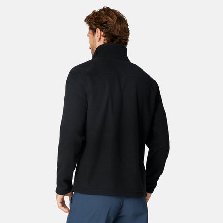[Matt is 6'2" wearing size M.] Man wearing Free Country Men's Calabaza II Brick Fleece Jacket in Black with a zipper chest pocket, convertible collar, smiling looking forward, light grey background.