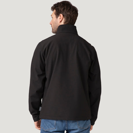 Back view of a man wearing a black Hanson II Super Softshell Jacket with a tall standing collar.