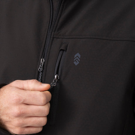 Close up of the black Hanson II Super Softshell Jacket zipper with a hand gripping it.