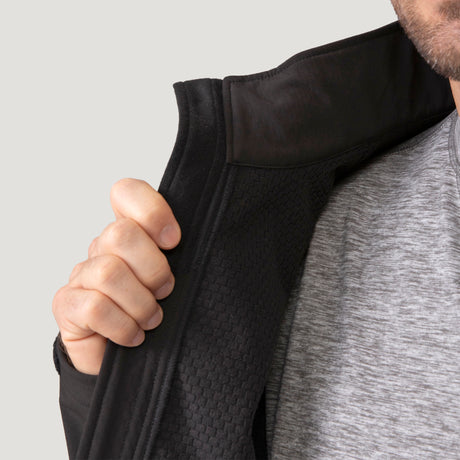 Detail of the jacket collar and zipper on the black Hanson II Super Softshell with a textured inner panel.