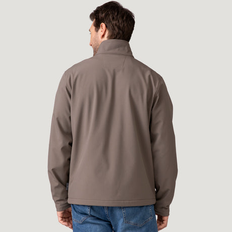 Back view of man wearing taupe Hanson II Super Softshell Jacket, visible collar and lower back hem.