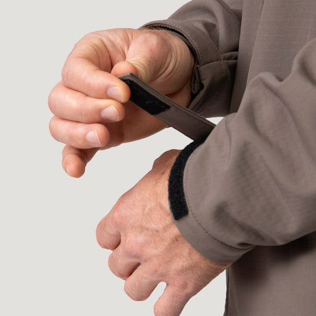 Person adjusts the cuff with a Velcro strap on Men's Hanson II Super Softshell Jacket in taupe