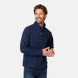 [Matt is 6'2" wearing size M.] Men’s Free Country navy zip-front softshell jacket with high stand collar and minimalistic design, worn over a light blue shirt and paired with blue jeans—delivering a clean, everyday look with subtle utility and transitional weather appeal.