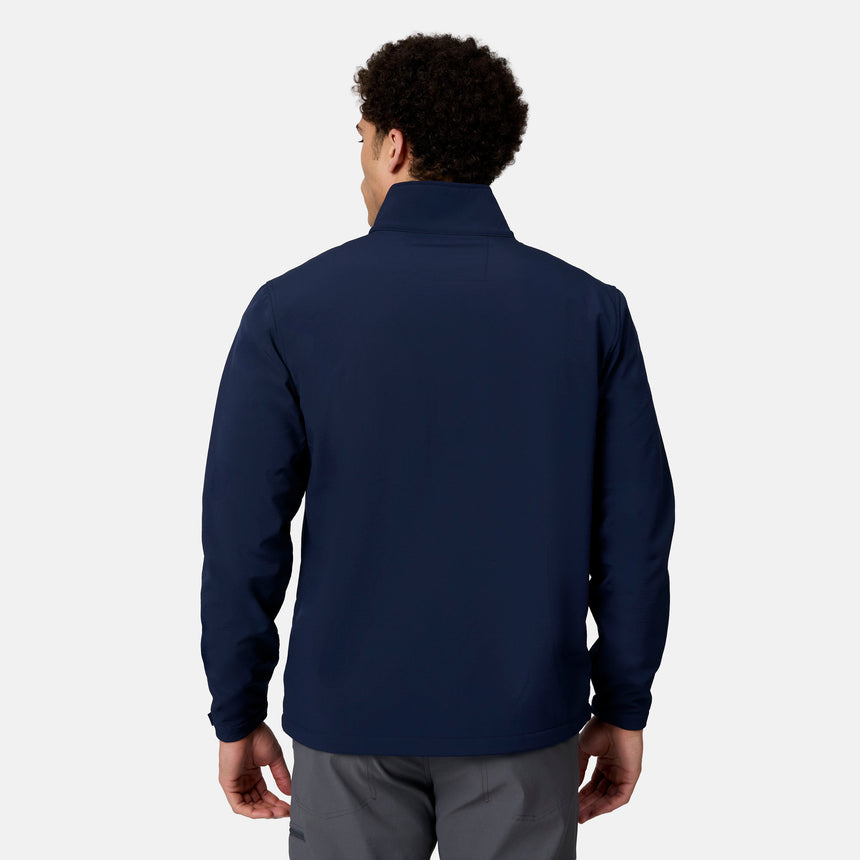 Back view of a person wearing a navy blue mock-neck weather resistant Men’s Hanson II Super Softshell® Jacket.