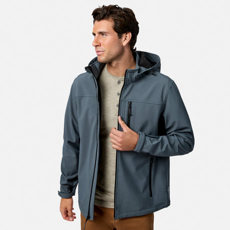 [Model is wearing size M.] A man wearing a slate blue-gray hooded softshell jacket over a light beige henley shirt, standing against a light gray studio background.