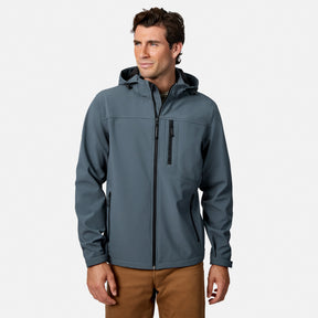 [Model is wearing size M.] A man wearing a slate blue-gray hooded zip-up jacket with a vertical chest pocket, paired with brown pants, photographed against a clean light gray studio background.