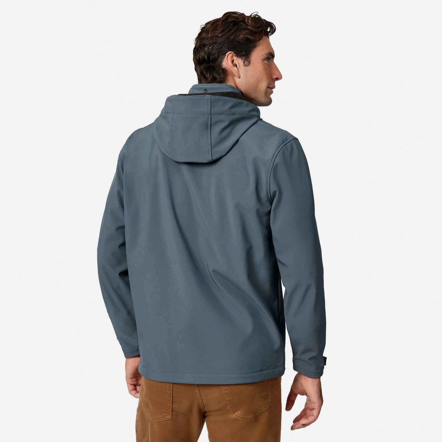 [Model is wearing size M.] A man wearing a slate blue hooded jacket, shown from the back and side profile against a light gray studio background.