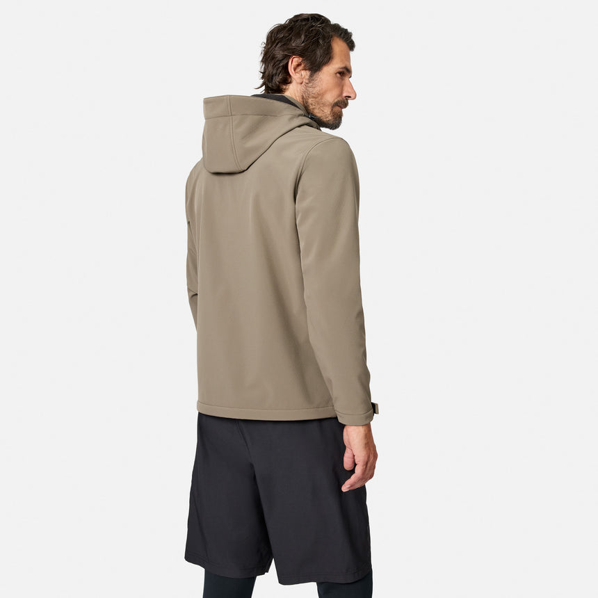 [Model is wearing size M.] A man wearing a light brown hooded jacket and dark shorts, shown from a side-back angle against a light gray studio background.