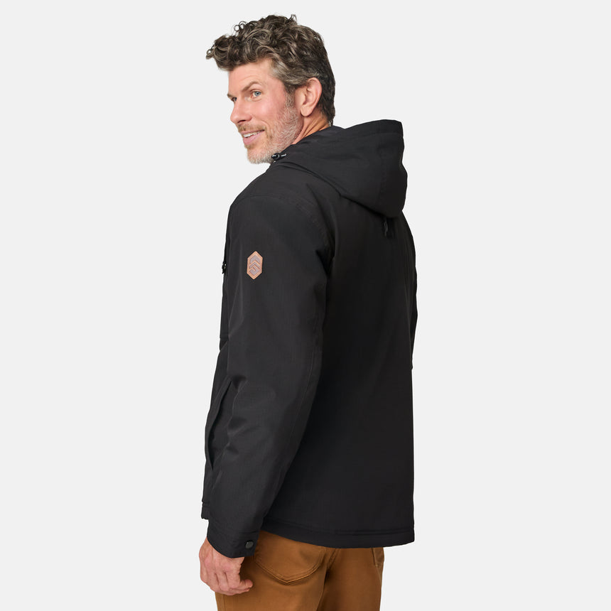[Kolby is 6'2" wearing size M.] Men’s Free Country black hooded jacket with full-zip front, dual flap chest pockets, and button cuffs—featuring a clean silhouette and utility styling. Paired with brown pants for a rugged, cold-weather look that blends trail-ready function with everyday wearability.