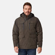 [Joe is 6'0" wearing size M.] Men’s Free Country brown hooded utility jacket featuring dual zippered chest pockets, flap waist pockets, and rugged outdoor styling—paired with blue jeans for a functional, adventure-ready look.