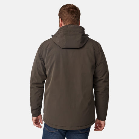 [Joe is 6'0" wearing size M.] Men’s Free Country brown hooded utility jacket featuring dual zippered chest pockets, flap waist pockets, and rugged outdoor styling—paired with blue jeans for a functional, adventure-ready look.