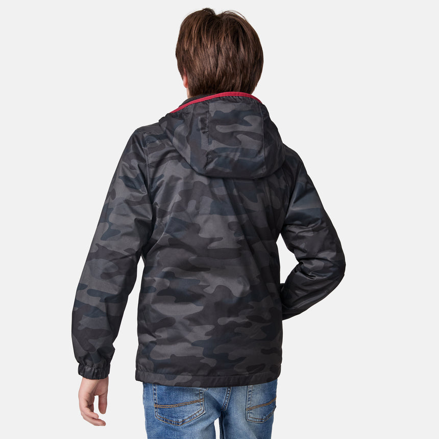 [River is wearing size M.] boys's camo hooded jacket with red accents and chest logo — cold-weather outerwear with zipper closure and hand pockets
