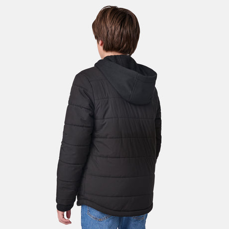 [River is wearing size M.] Model in a Free Country black quilted hooded jacket with button-up front, dual flap chest pockets, side hand pockets, and a branded emblem on the left sleeve—designed for modern outdoor wear, styled with blue jeans.