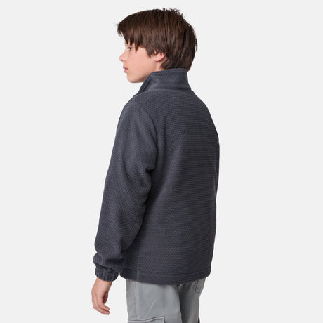 [River is wearing size M] Model in a two-tone Free Country system jacket featuring a dark gray upper shell and lighter gray lower body; complete with zip-out fleece liner, side-entry pockets, and an adjustable hood—styled with tonal gray pants for streamlined, cold-weather versatility.