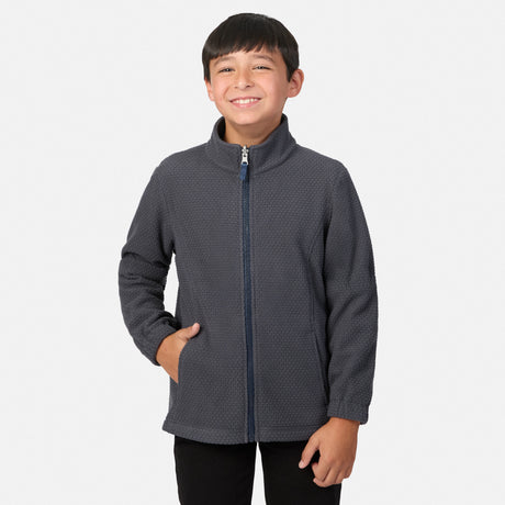 A boy smiles while wearing a gray zip-up textured fleece Boys’ High Stretch 3-in-1 Systems Jacket featuring a blue zipper.