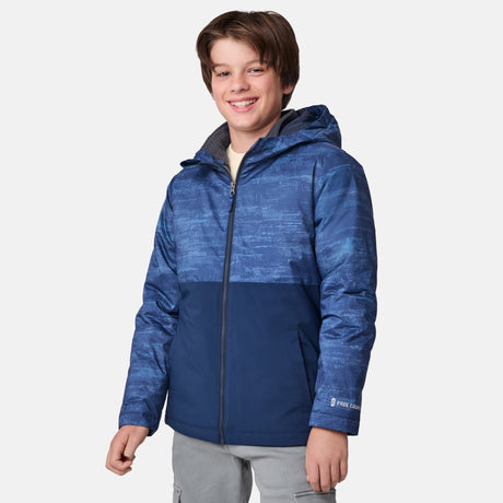 [River is wearing size M]Model in a two-tone blue Free Country 3-in-1 system jacket featuring zip-out fleece lining, rugged shoulder textures, and a smooth shell exterior; styled with a light base layer for adaptable, cold-weather comfort.