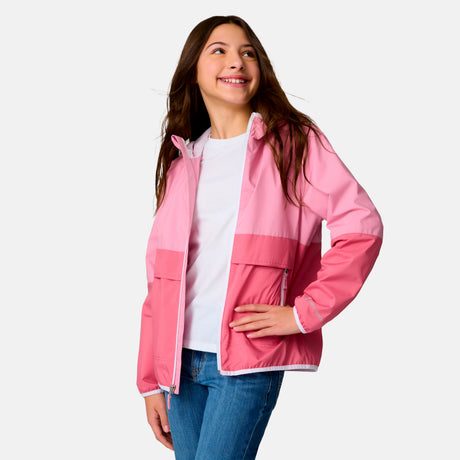 [Model is wearing a size Medium.] Girl wearing the Free Country Girls' Easy Hiking Windshear Jacket in Rose Petal, size M, featuring two tones color made from recycled polyester fabric that provides four way stretch and water and wind resistance, layered over a white t shirt with blue jeans #color_ Rose-Petal