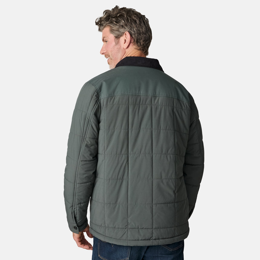 [Kolby is 6'2" wearing size M.] Men’s Free Country green quilted jacket with black corduroy-style collar and button-up front—featuring dual flap chest pockets, angled side hand pockets, and a rugged outdoor look. Paired with dark pants for versatile, cold-weather styling.