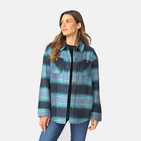 [Olga is 5'9" wearing a size Small.] Woman wearing Free Country Women's Hayley Plaid Shacket in blue and grey and green plaid with a full front button opening, chest pockets, light grey background. Best women’s jacket for fall weather.