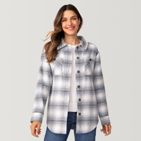 [Olga is 5'9" wearing a size Small.] Woman wearing Free Country Women's Hayley Plaid Shacket in blue and grey and white plaid with a full front button opening, chest pockets, light grey background. Best women’s jacket for fall weather.