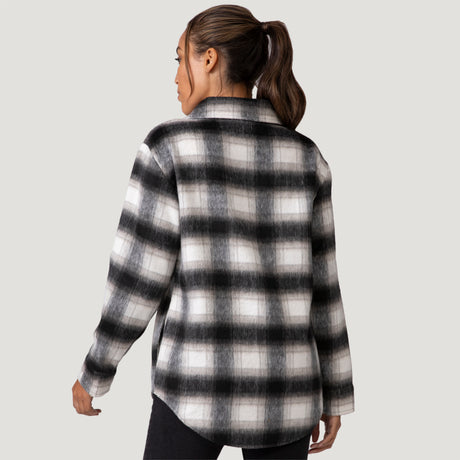 [Shelby is 5'9" wearing a size Small.] Woman wearing Free Country Women's Hayley Plaid Shacket in black and white plaid with a full front button opening, chest pockets, light grey background. Best women’s jacket for fall weather.