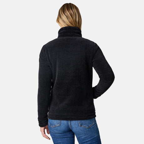 A woman viewed from the back wearing a dark charcoal heathered fleece pullover sweater and blue jeans against a light gray studio background.