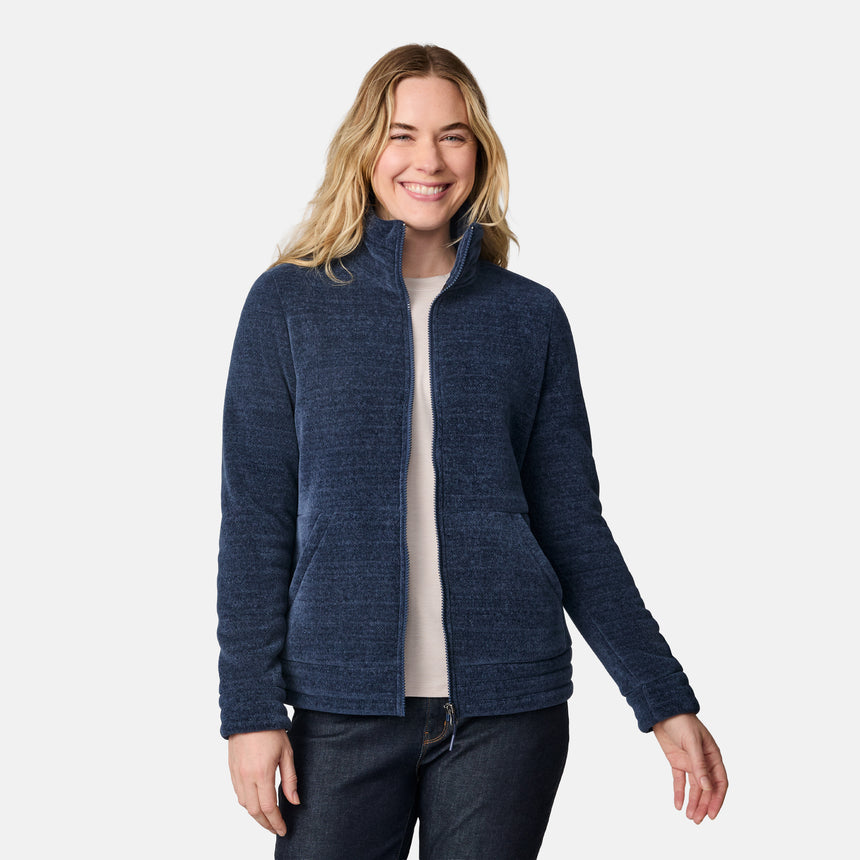 [CJ is 5'10" wearing size S.] Women’s dark blue zip-up fleece jacket with high collar, soft textured fabric, and dual front pockets—features a patch on the left sleeve and is styled with hands in pockets against a plain white background.