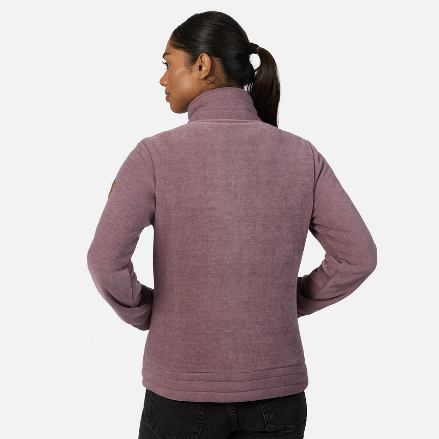 [Model is wearing size S.] A woman modeling a dusty mauve zip-up fleece jacket, paired with black pants and tan boots, against a plain light gray studio background.