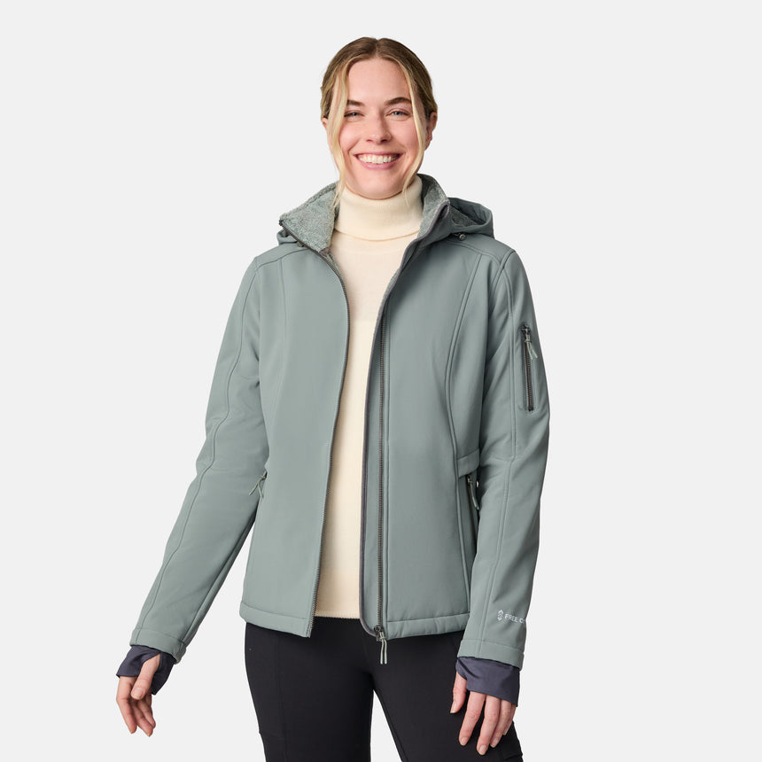 [CJ is 5'10" wearing size S.] Woman wearing a green Free Country softshell jacket with a hood on a white background