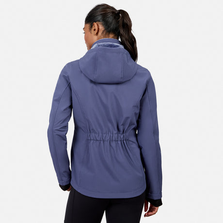 [Model is wearing size S.] A woman shown from the back wearing a slate blue hooded jacket with a drawstring waist, paired with black pants, against a light gray studio background.