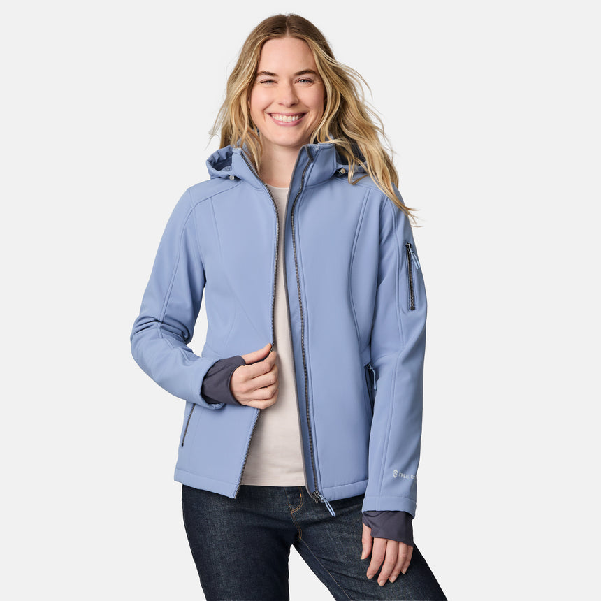 [CJ is 5'10" wearing size S.] Woman wearing a blue Free Country softshell jacket with a hood on a white background