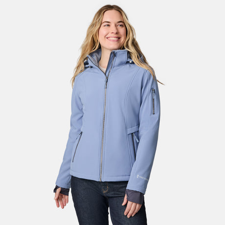 [CJ is 5'10" wearing size S.] Woman wearing a blue Free Country softshell jacket with a hood on a white background