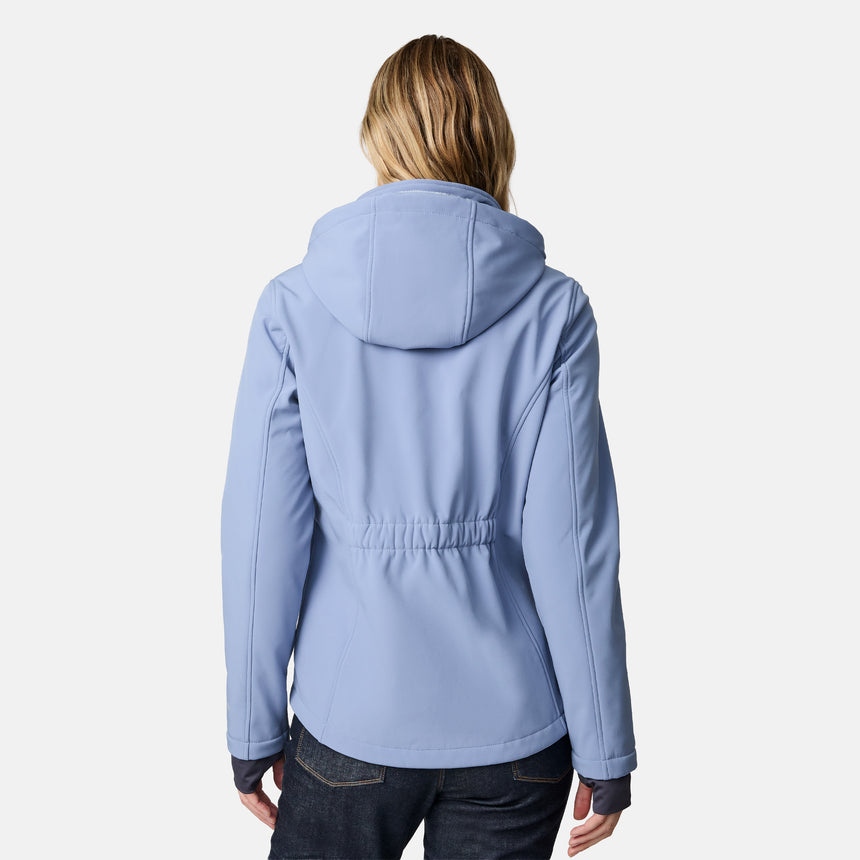 [CJ is 5'10" wearing size S.] Woman wearing a blue Free Country softshell jacket with a hood on a white background