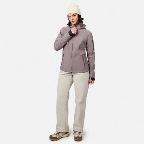 [Model is wearing size S.] A woman modeling a light grayish-purple hooded jacket, beige pants, and a cream beanie against a plain light gray studio background.