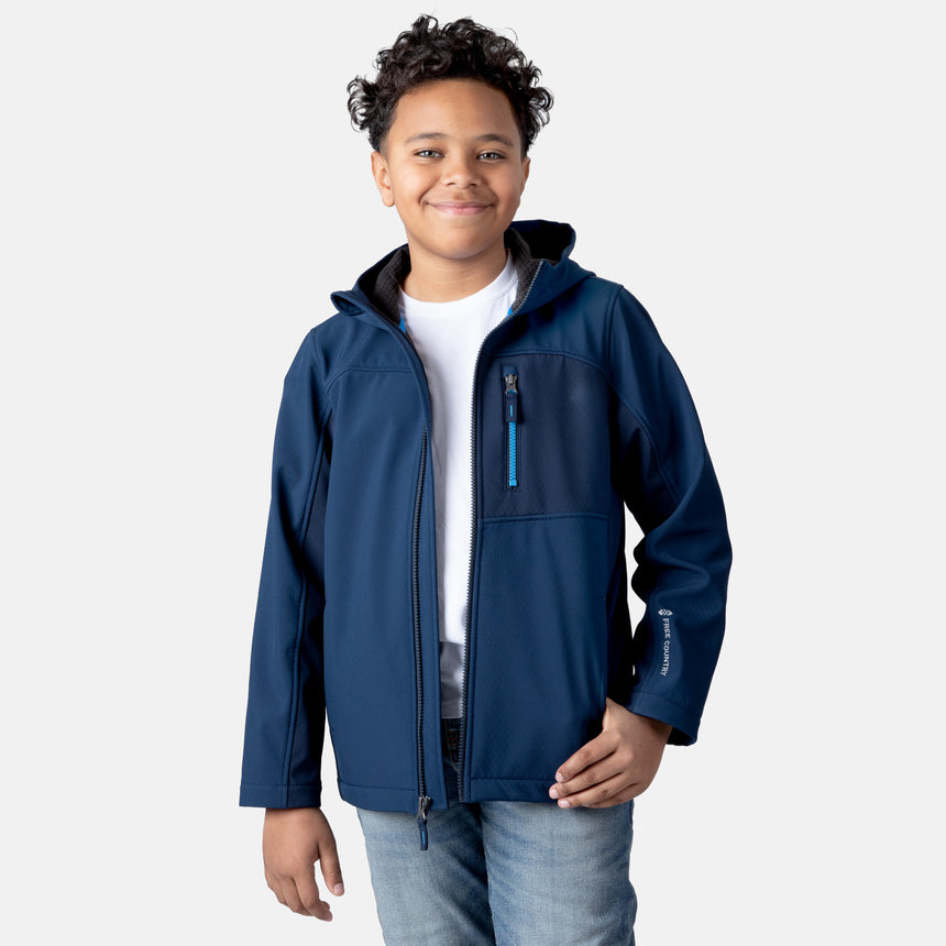 [Model is wearing size M.] Model wearing a blue Free Country softshell jacket with a contrast zippered chest pocket and side-entry hand pockets; lightweight water-resistant construction with an active fit, ideal for transitional weather and casual outdoor wear.