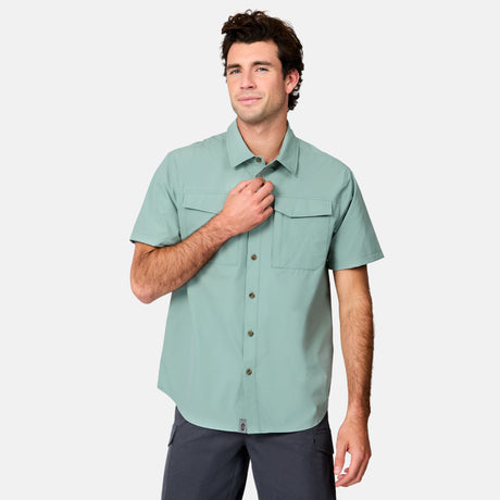 [Jacob is 6’1.5” wearing size M] Man wearing a light green short-sleeve shirt on a white background
