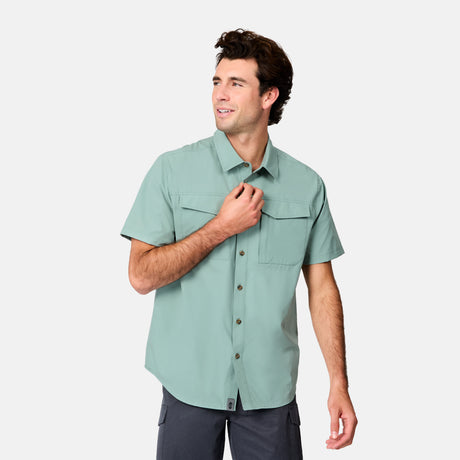 [Jacob is 6’1.5” wearing size M] Man wearing a light green short-sleeve shirt on a white background