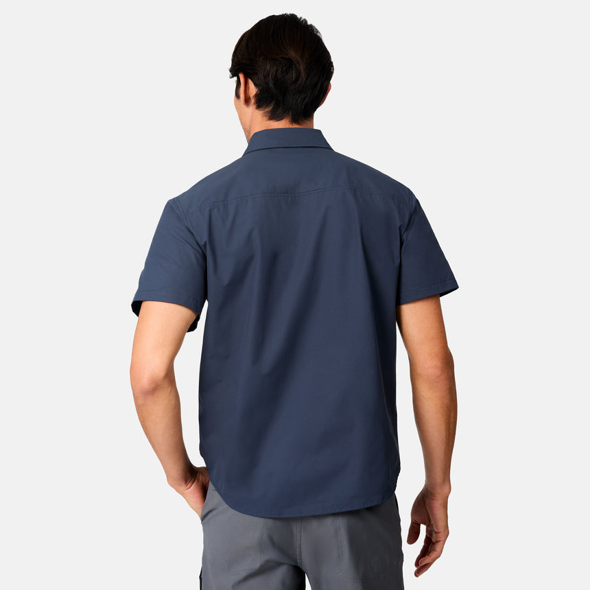 [Scott is 6’3 wearing size M] Man wearing a navy blue short-sleeve button up shirt on a white background