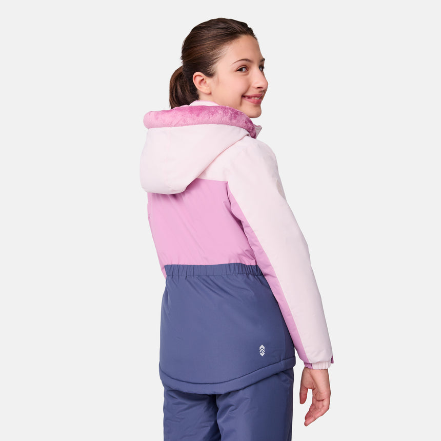 [Samantha is wearing size M.] Model wearing a Free Country color-blocked winter jacket in pink and navy, featuring a fuzzy-lined hood, zippered chest and hand pockets, and insulated design for cold-weather comfort. Paired with matching navy snow pants for outdoor adventures.