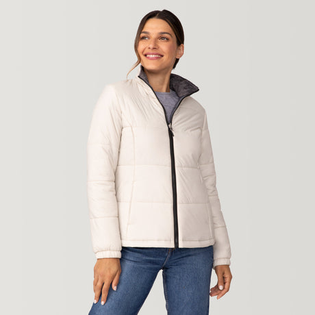[Olga is 5’9” wearing a size Small.] Woman wearing Free Country Women's Back of Bell 3-in-1 Systems Jacket in white with a full front zipper opening, soft lining, attached hood with adjustable drawcords, and water resistant and wind resistant stretch performance fabric, inner puffer jacket, outer shell for weather, light grey background. Perfect women’s  jacket for fall weather.