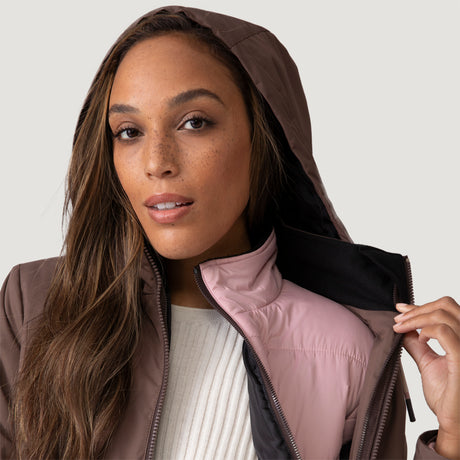 [Shelby is 5’9” wearing a size Small.] Woman wearing Free Country Women's Back of Bell 3-in-1 Systems Jacket in brown with a full front zipper opening, soft lining, attached hood with adjustable drawcords, and water resistant and wind resistant stretch performance fabric, inner puffer jacket, outer shell for weather, light grey background. Perfect women’s  jacket for fall weather.