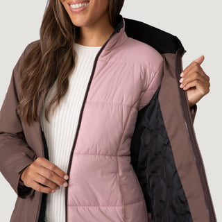 [Shelby is 5’9” wearing a size Small.] Woman wearing Free Country Women's Back of Bell 3-in-1 Systems Jacket in brown with a full front zipper opening, soft lining, attached hood with adjustable drawcords, and water resistant and wind resistant stretch performance fabric, inner puffer jacket, outer shell for weather, light grey background. Perfect women’s  jacket for fall weather.