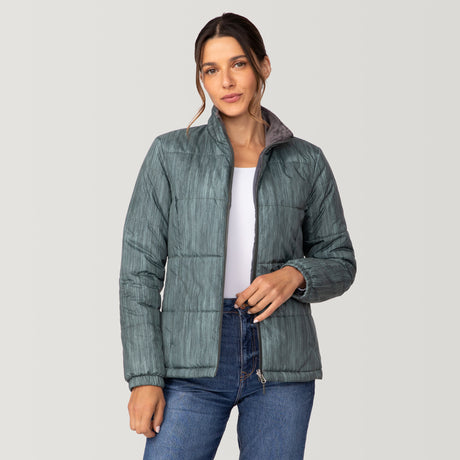 [Olga is 5’9” wearing a size Small.] Woman wearing Free Country Women's Back of Bell 3-in-1 Systems Jacket in light blue with a full front zipper opening, soft lining, attached hood with adjustable drawcords, and water resistant and wind resistant stretch performance fabric, inner puffer jacket, outer shell for weather, light grey background. Perfect women’s  jacket for fall weather.