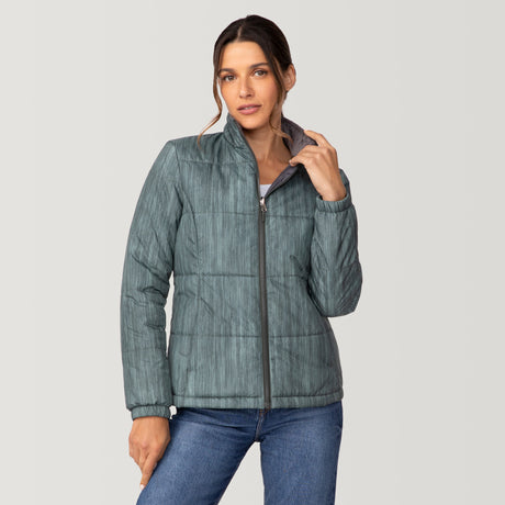 [Olga is 5’9” wearing a size Small.] Woman wearing Free Country Women's Back of Bell 3-in-1 Systems Jacket in light blue with a full front zipper opening, soft lining, attached hood with adjustable drawcords, and water resistant and wind resistant stretch performance fabric, inner puffer jacket, outer shell for weather, light grey background. Perfect women’s  jacket for fall weather.